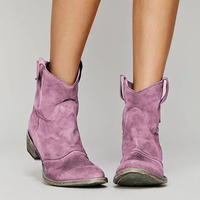 Flat lay of cowboy boots in multiple color options including blue, gray, and brown