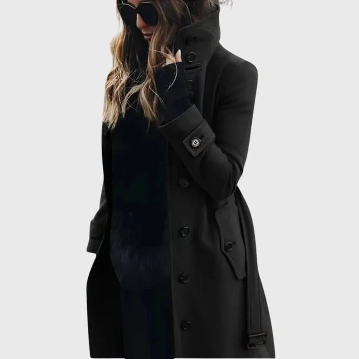 Side profile of the longline water-repellent trench coat showing the tailored silhouette and structured hem