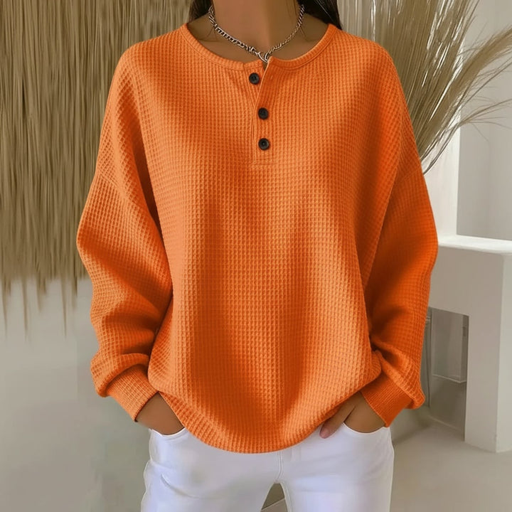 Alexa waffle sweater in white showing the relaxed drape and cozy everyday silhouette
