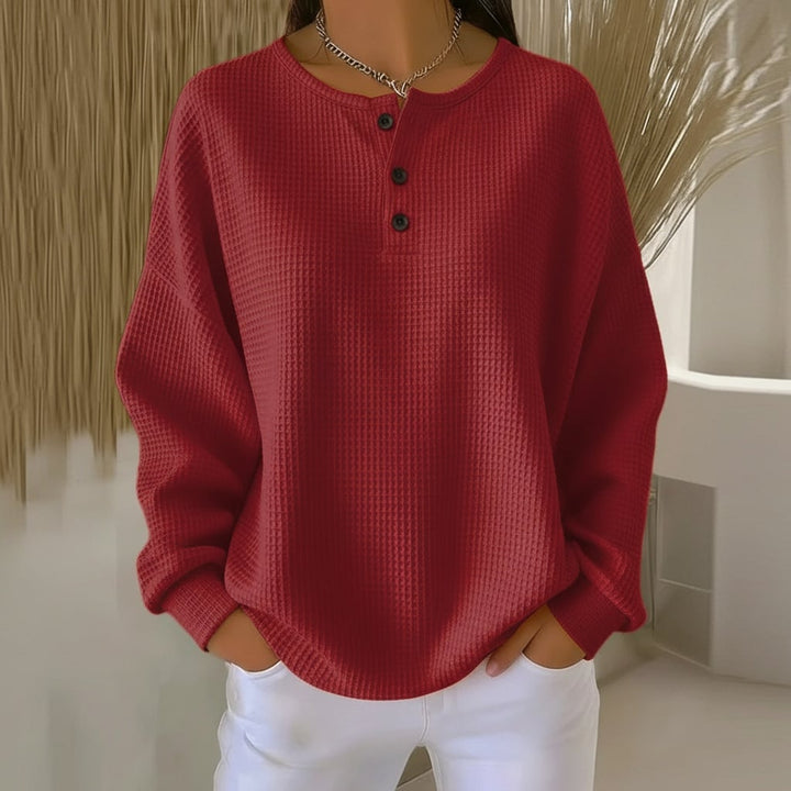 Alexa waffle sweater laid flat showing color options including red, black, orange, and white