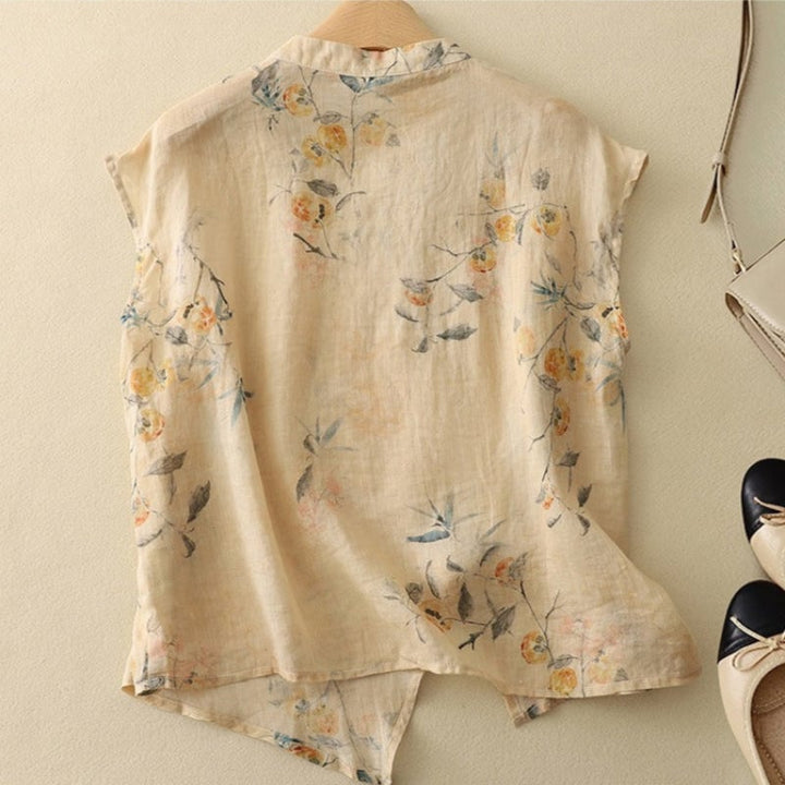 Side view of a flowy sleeveless floral top showing the relaxed silhouette and mandarin neckline