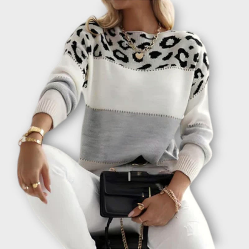 Front view of the Amelia elegant sweater in gray, featuring a flattering silhouette and soft knit fabric