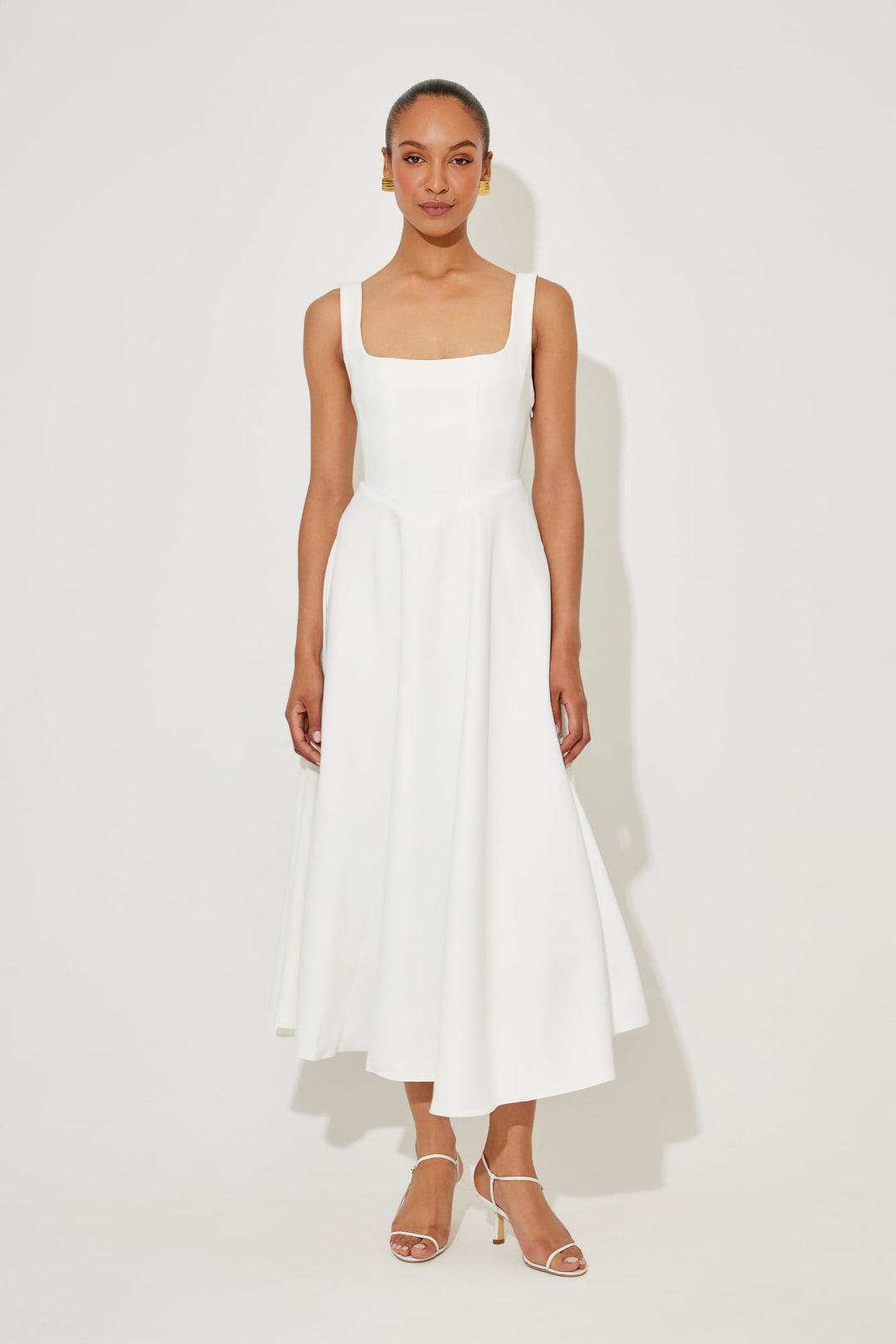 Front view of the BobaFashion flowy midi dress in white with a square neckline and fitted waist