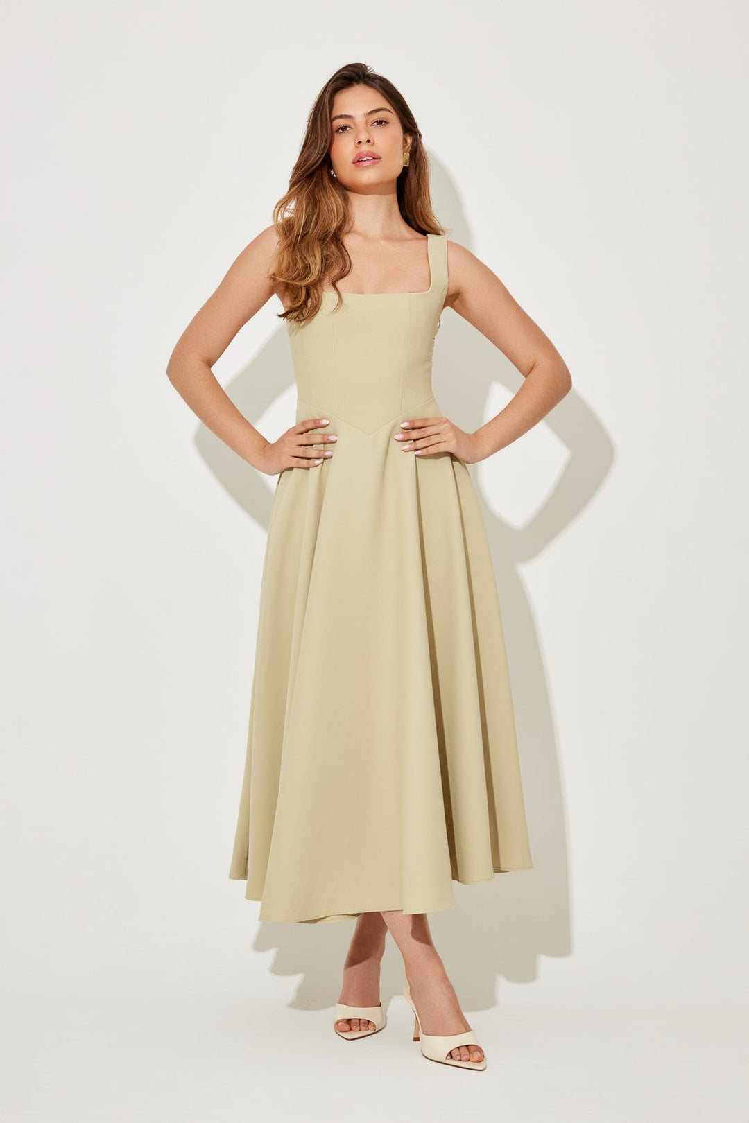 Full-length shot of the BobaFashion midi dress in black with a waist-defining silhouette