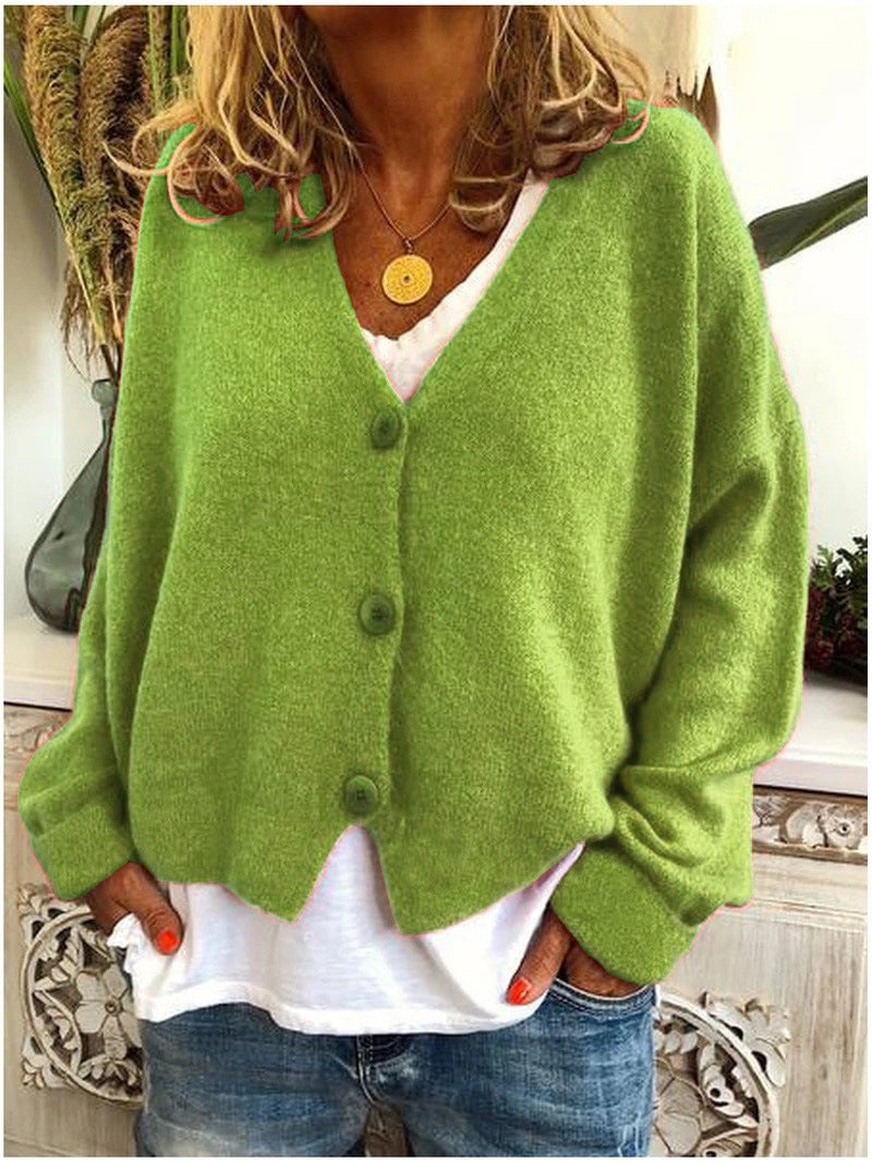 Model wearing the Annelise layering cardigan in a bold color option, shown from the front