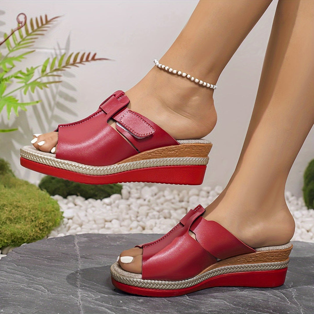 Close-up of Aster sandal cushioned insole and strap detail in magenta