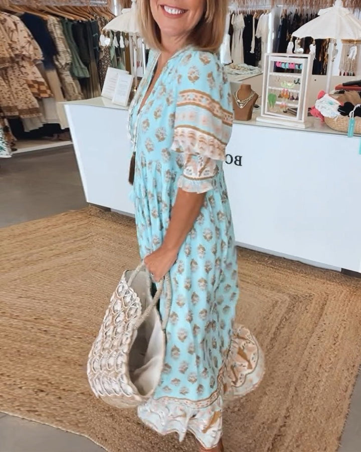 Back view of boho midi tassel dress in blue showing relaxed fit and tassel detailing