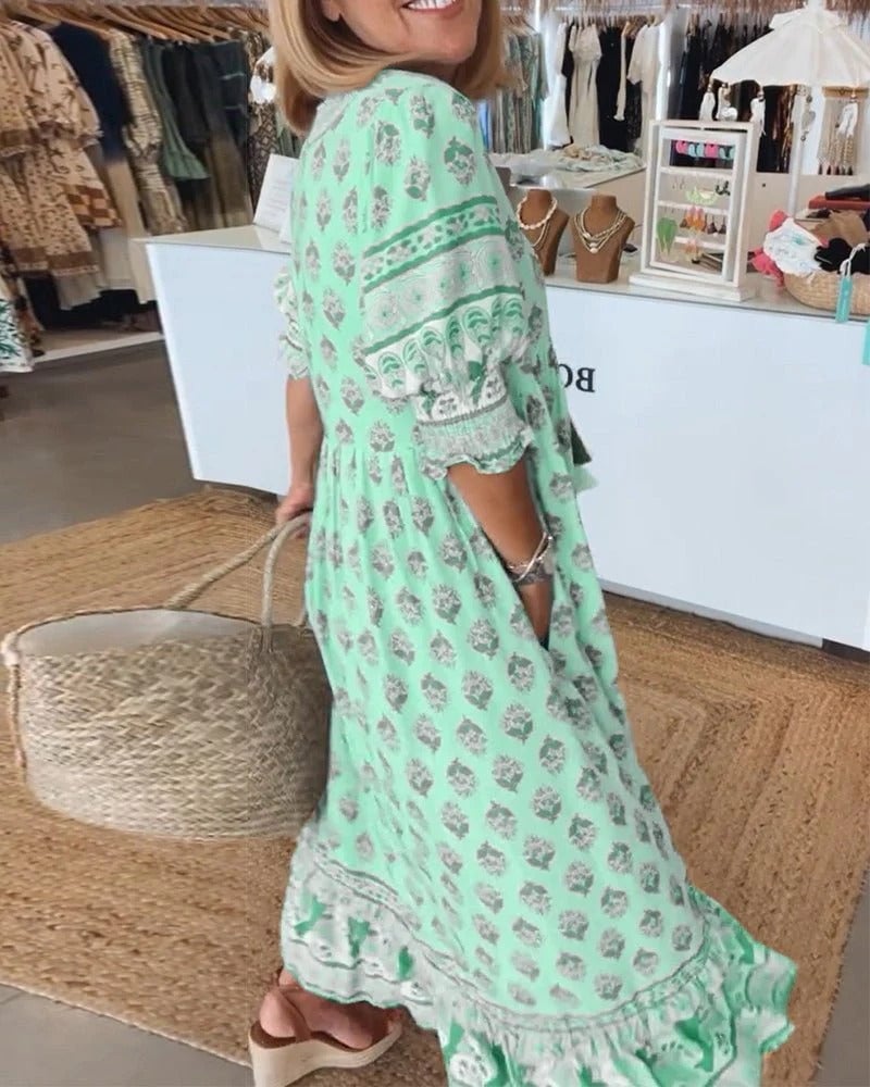 Boho midi tassel dress in green shown in natural outdoor light