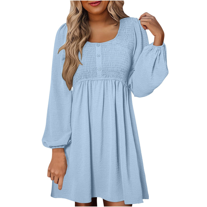 Front view of smocked empire waist mini dress in apricot