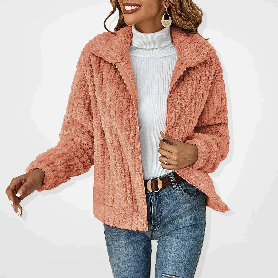 Side profile of woman in the Ava elegant plush jacket showing sleek feminine silhouette and arm coverage