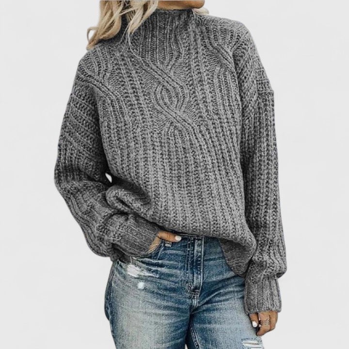 Full-length view of the Avery Sophisticated Sweater paired with jeans for a casual chic look