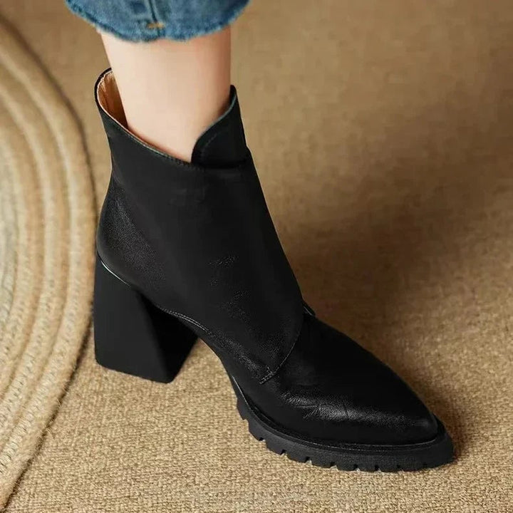 Side profile of the BobaFashion Aziel boot showing streamlined silhouette in black