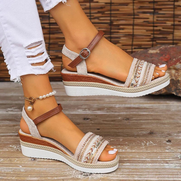 Front view of Barbara relaxed summer sandals with woven and beaded boho details on a neutral background