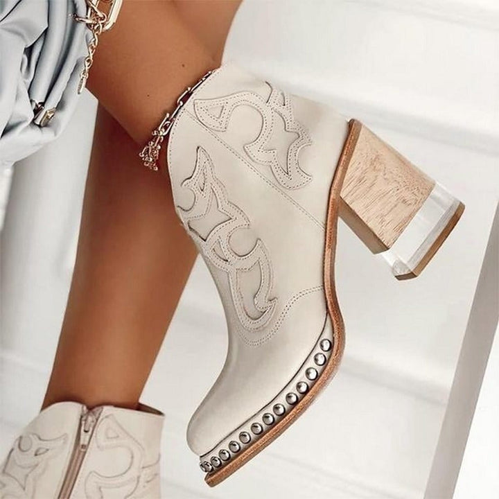 Bella western boots in Vegas White paired with a flowy midi skirt