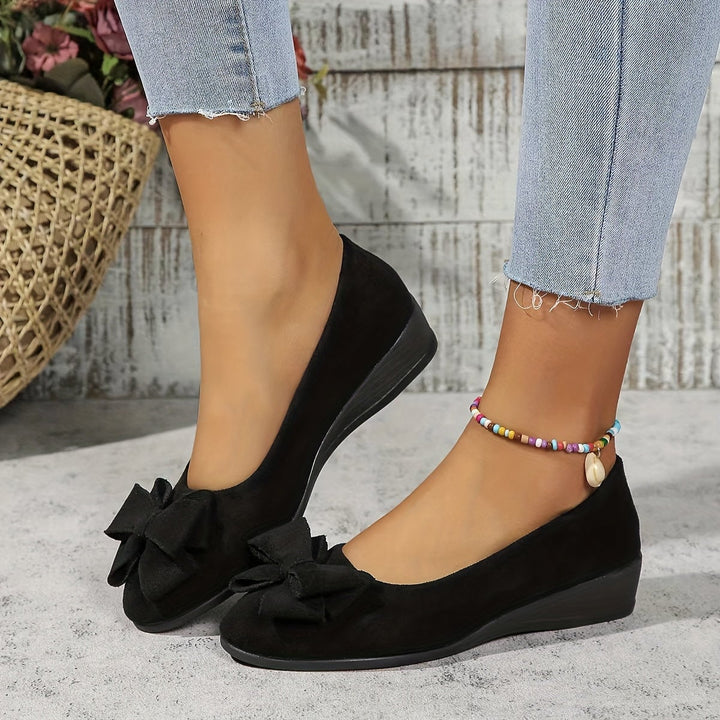 Gray suede-look ballet flat with bow detail, side view