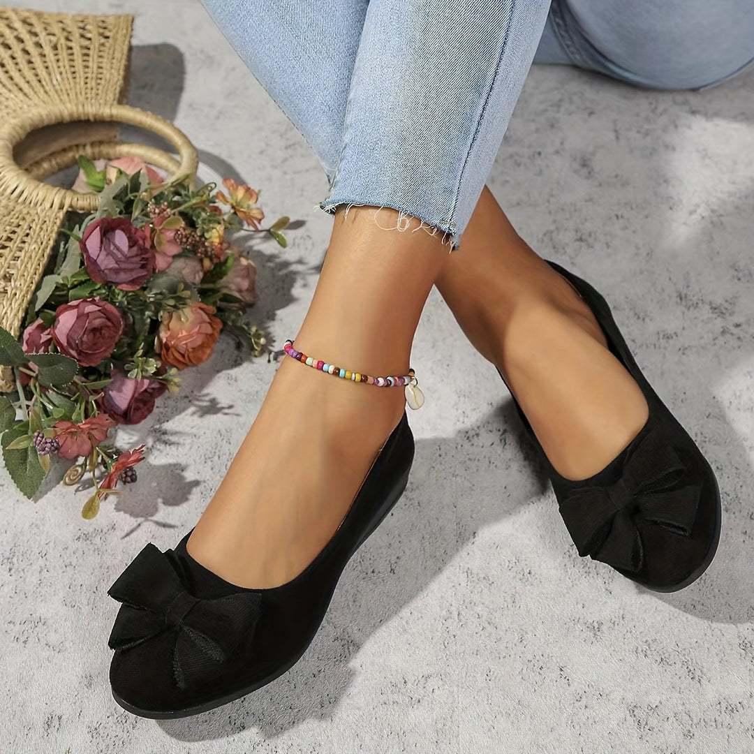 All four color options of Bella bow ballet flats — black, gray, blue, and brown