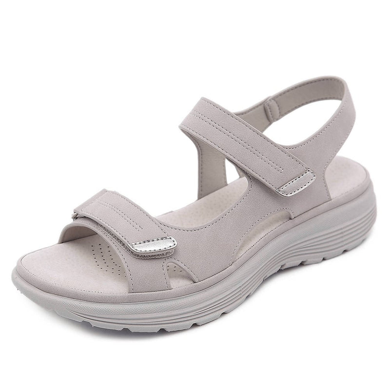 Blue orthopedic sandal flat lay on a light surface highlighting strap design