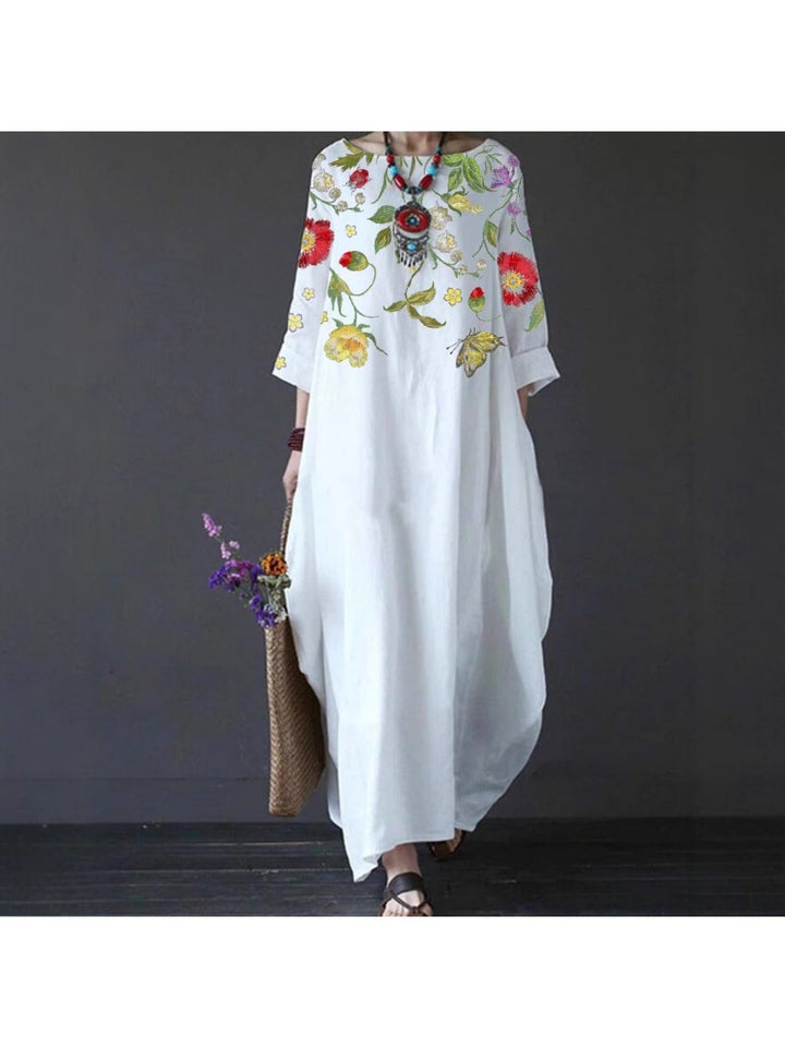 Side view of woman in the Blair floral maxi dress highlighting the graceful drape and movement