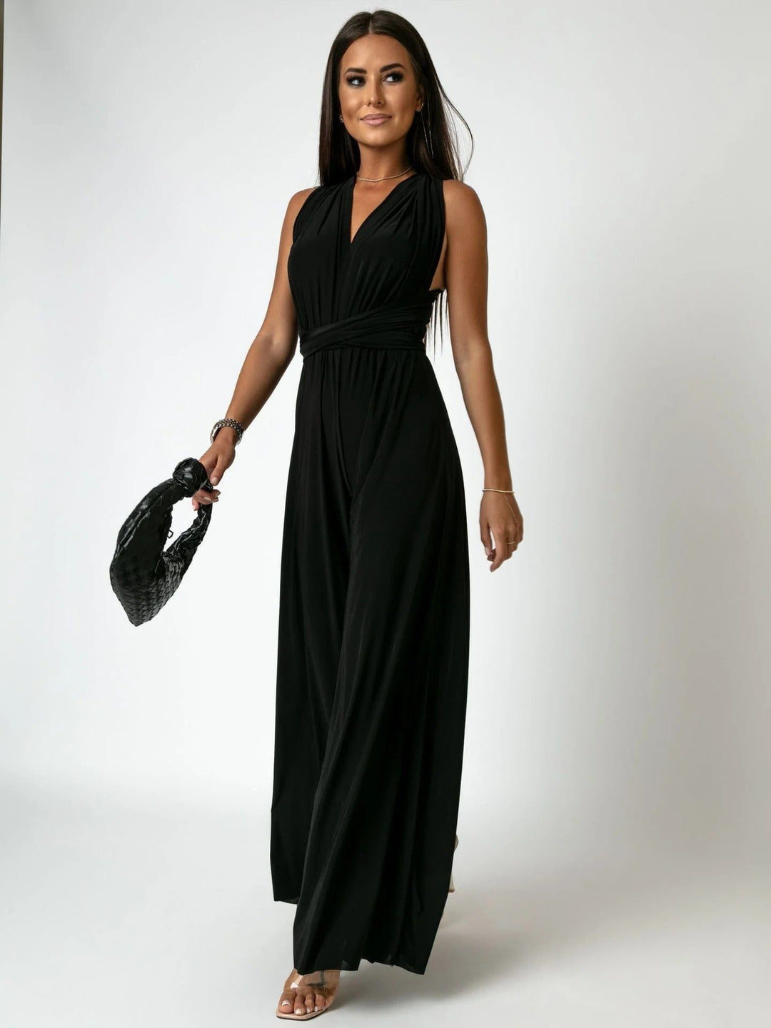 Women's wide-leg wrap tie jumpsuit with deep V-neckline and ruched waist in a soft blush peach color