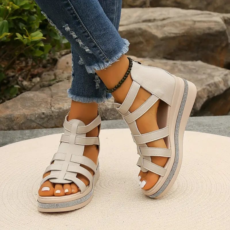 Blythe wedge sandals in black shown from the front on a clean background