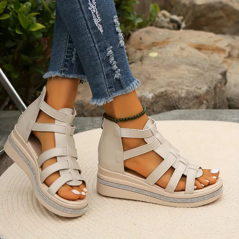 Model walking in Blythe beige wedge sandals showing comfortable fit