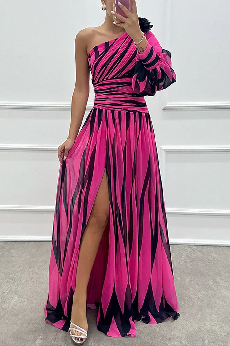 Close-up of the asymmetrical one-shoulder neckline on a striped maxi dress in navy blue