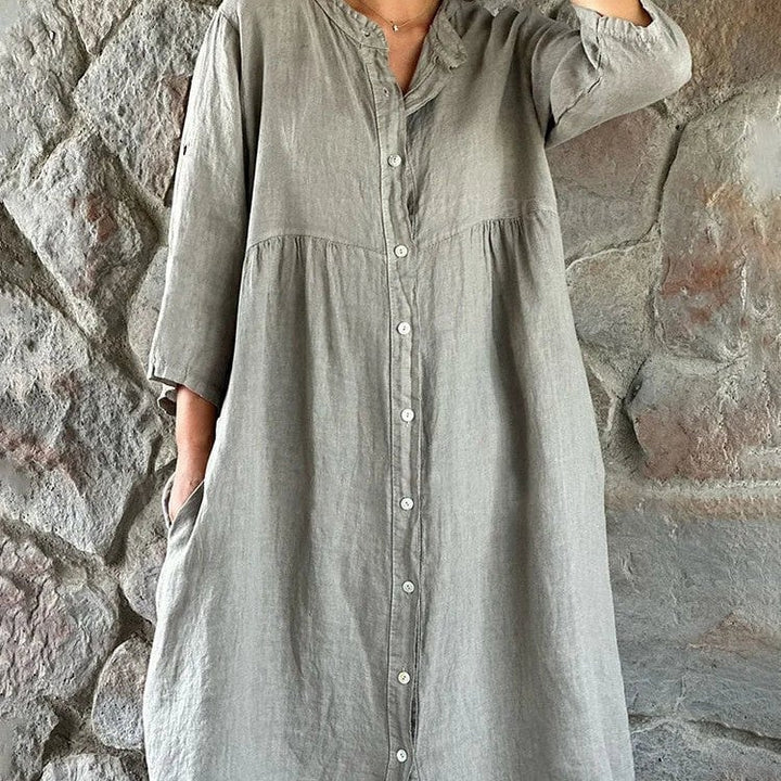 Woman wearing the Briar flowy midi dress in a graceful feminine silhouette showing the full-length flowing skirt