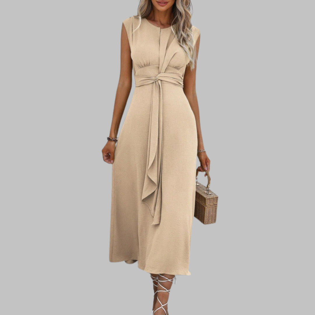 Sleeveless maxi dress in maroon displayed on a model in a relaxed standing pose