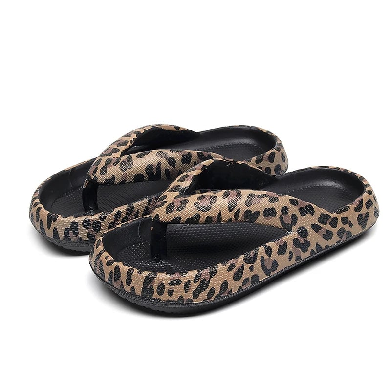 Brooke Black sandal worn on foot, walking on light pavement