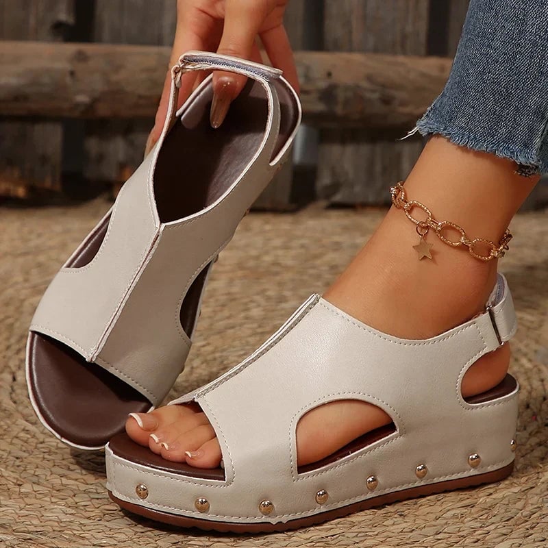 Camellia platform sandals in beige, styled on feet to show fit and platform lift