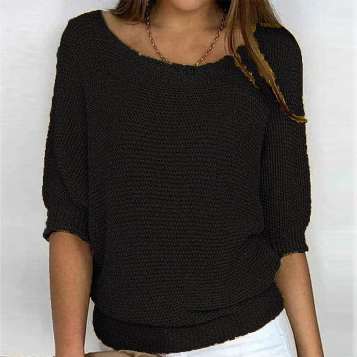 Model wearing the Carla comfort sweater outdoors on a cool autumn day
