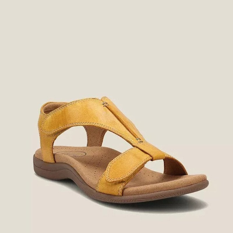 Side profile of Carolyn vegan leather sandal showing gel midsole and flexible outsole construction