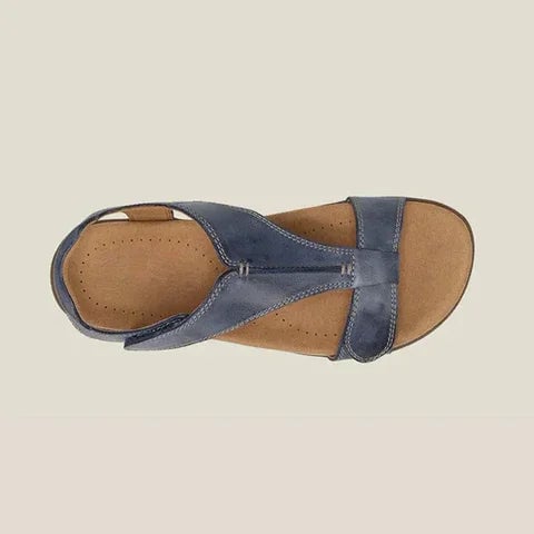 Flat lay of all six Carolyn sandal color options: orange, yellow, beige, blue, grey, and black