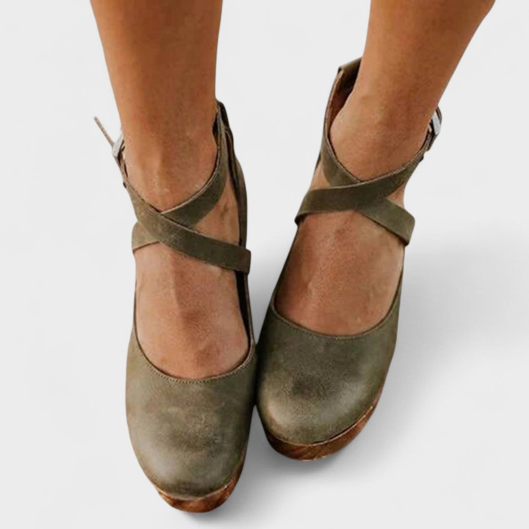 Catalina flat sandal in brown displayed on a neutral background