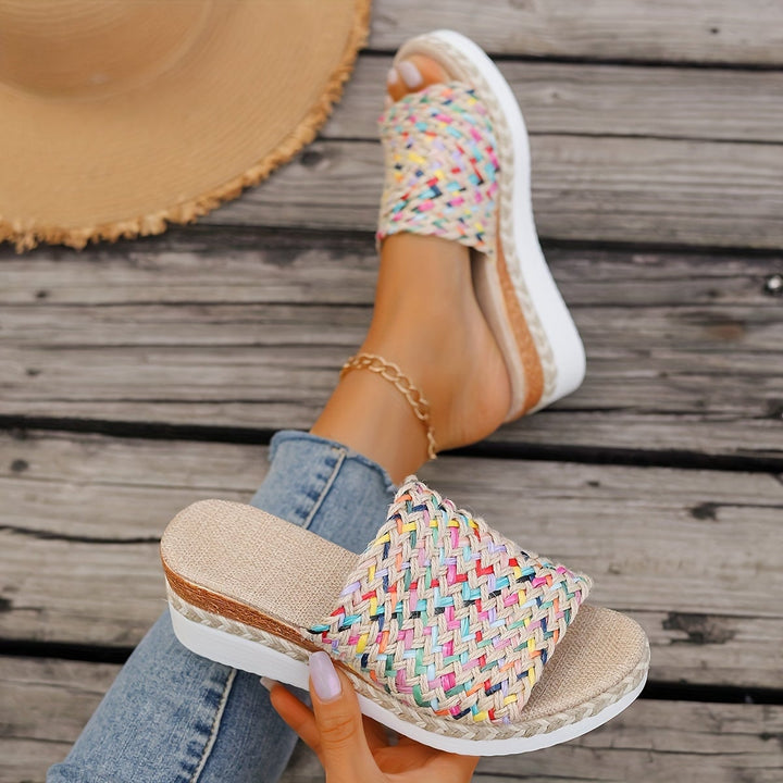 Top-down view of Celeste beige woven wedge sandals highlighting strap texture