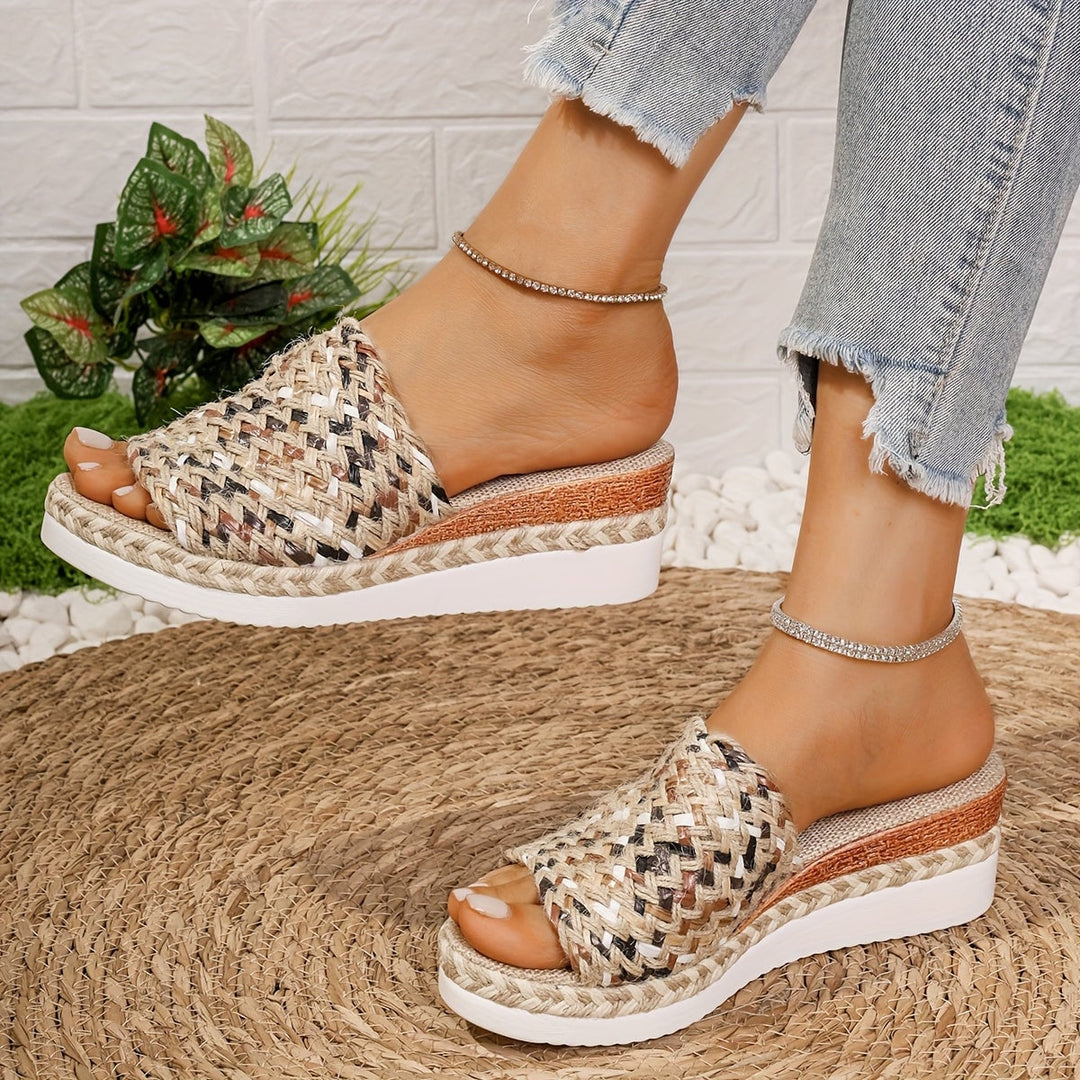 Celeste yellow woven wedge sandals shown at an angle to display sole and heel