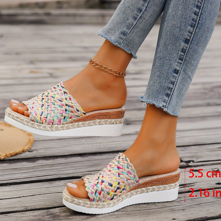 Celeste woven wedge sandals in multicolor styled with cropped linen trousers