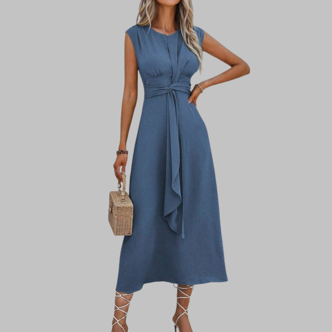 Close-up of the self-tie sash belt and round neckline on the Celeste midi dress