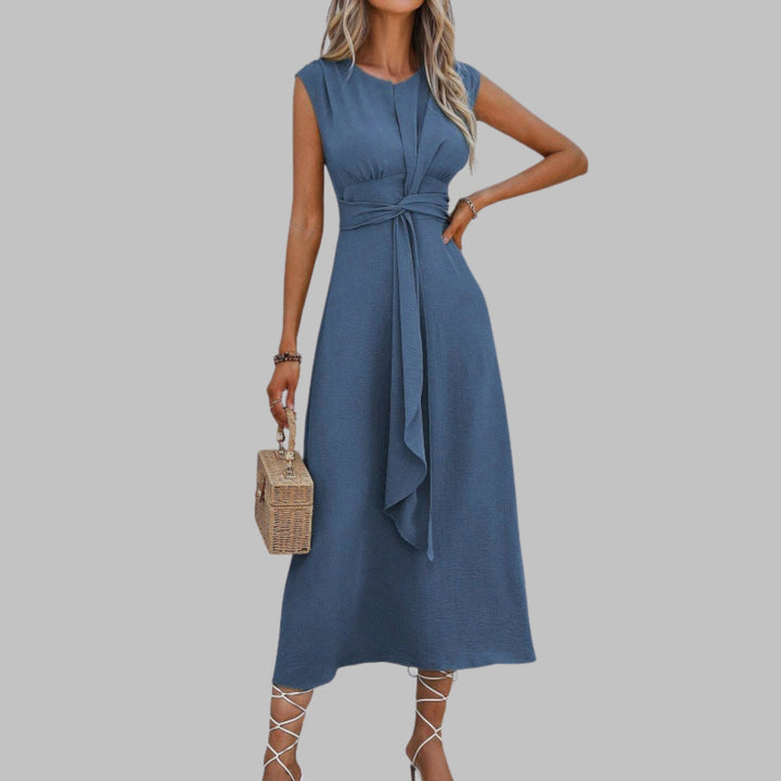 Close-up of the self-tie sash belt and round neckline on the Celeste midi dress