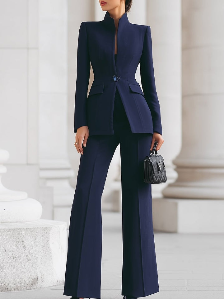 Front view of the Celeste stand collar blazer and wide leg pants suit set in blue on a model