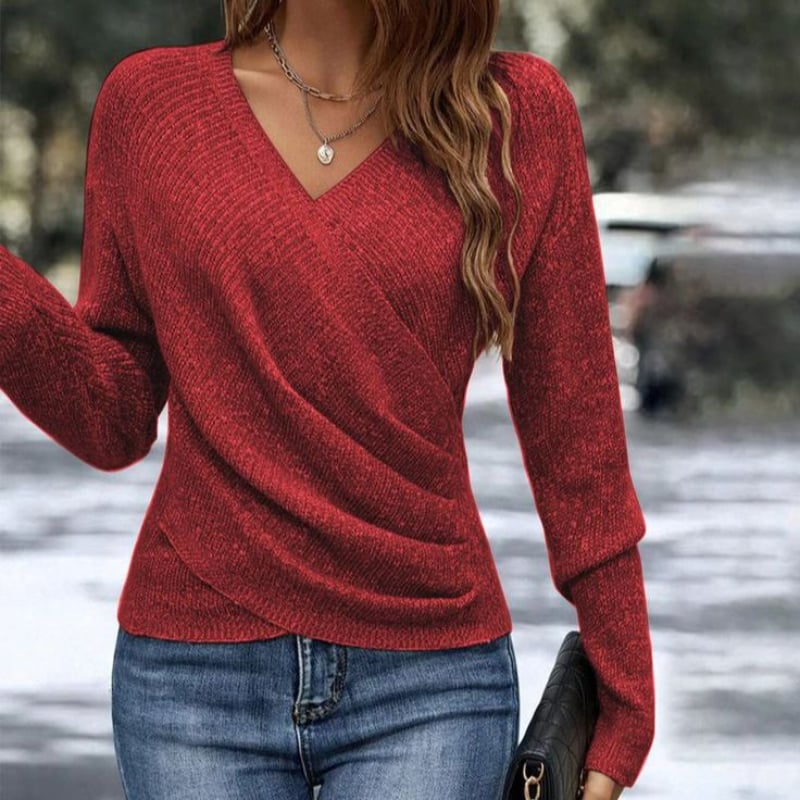 Side view of the Celeste V-neck wrap sweater in red highlighting the waist-cinching crossover silhouette
