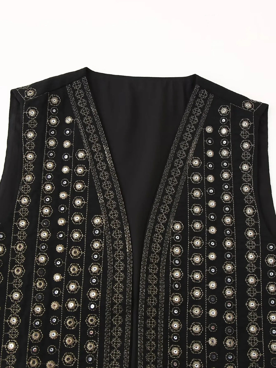 Model wearing black sequin boho vest layered over a camisole top
