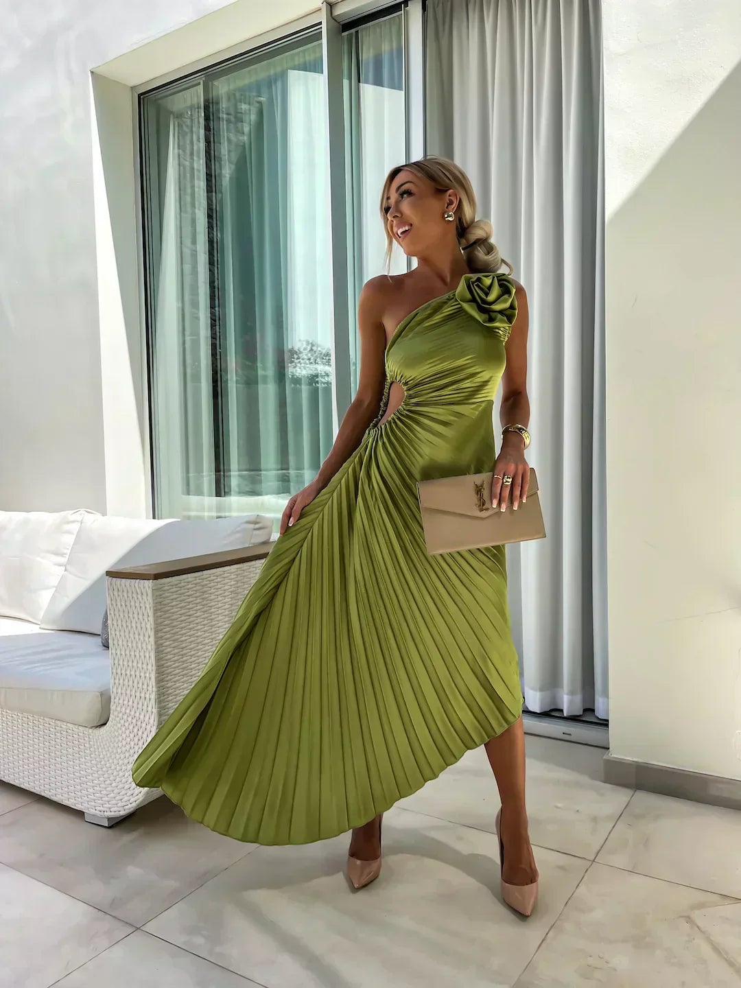 Side profile of the Charlotte dress in black showing the lightweight draped fabric in motion