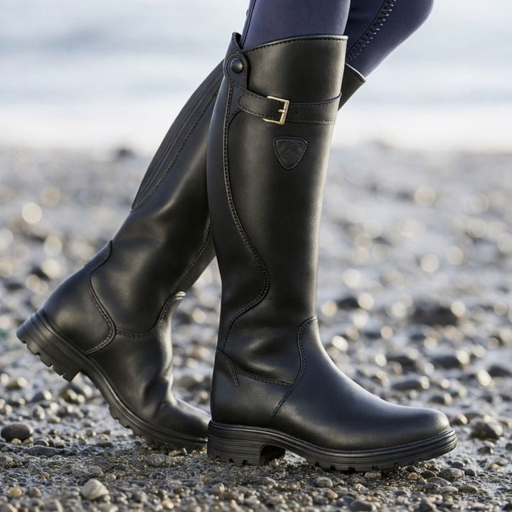 BobaFashion Christine waterproof boots in dark brown shown on a rainy urban sidewalk