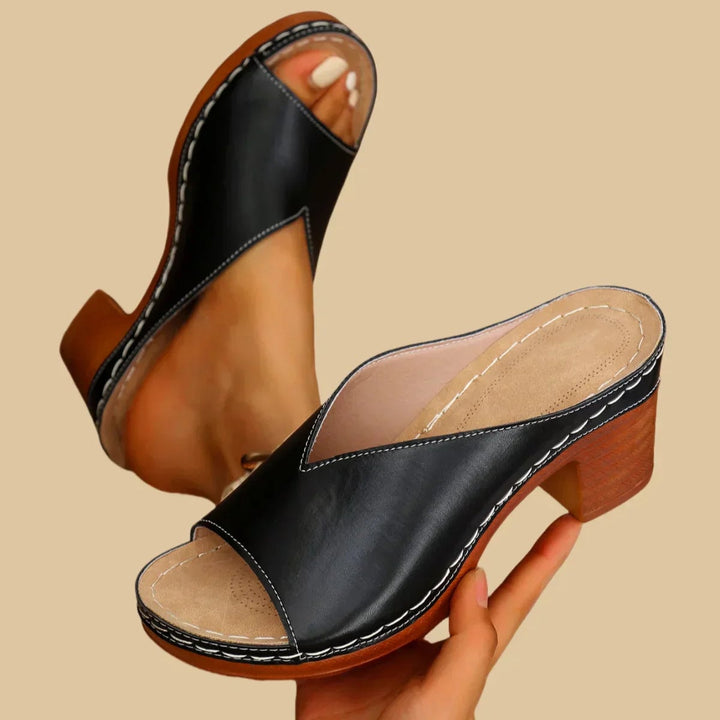 Black Claudette orthopedic sandals highlighting thick stable heel and ergonomic footbed
