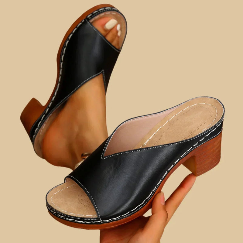 Black Claudette orthopedic sandals highlighting thick stable heel and ergonomic footbed