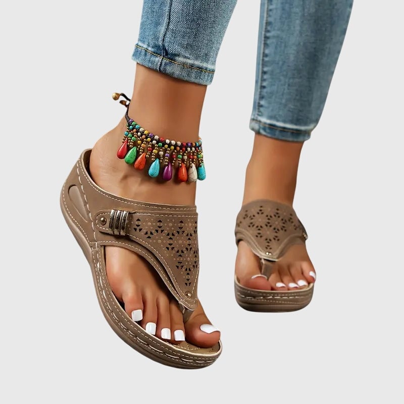Cleo wedge toe loop sandals displayed in multiple colors: black, navy, brown, and khaki