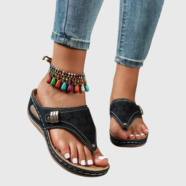 Model wearing the Cleo wedge sandals with a casual summer outfit, showcasing the flattering wedge lift