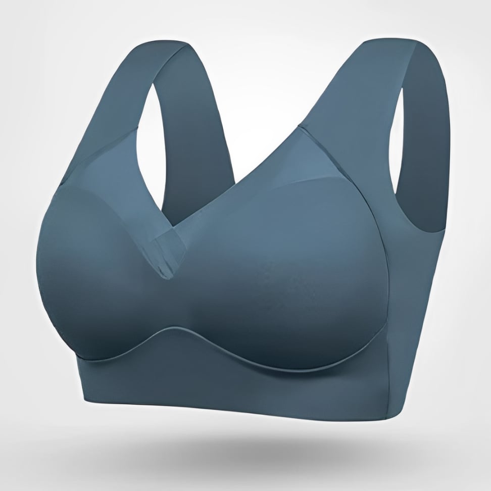 Model wearing seamless bra in beige showing natural lift and smooth silhouette under fitted top