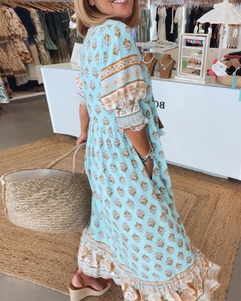 Full-length side profile of Cordelia flowy dress in blue